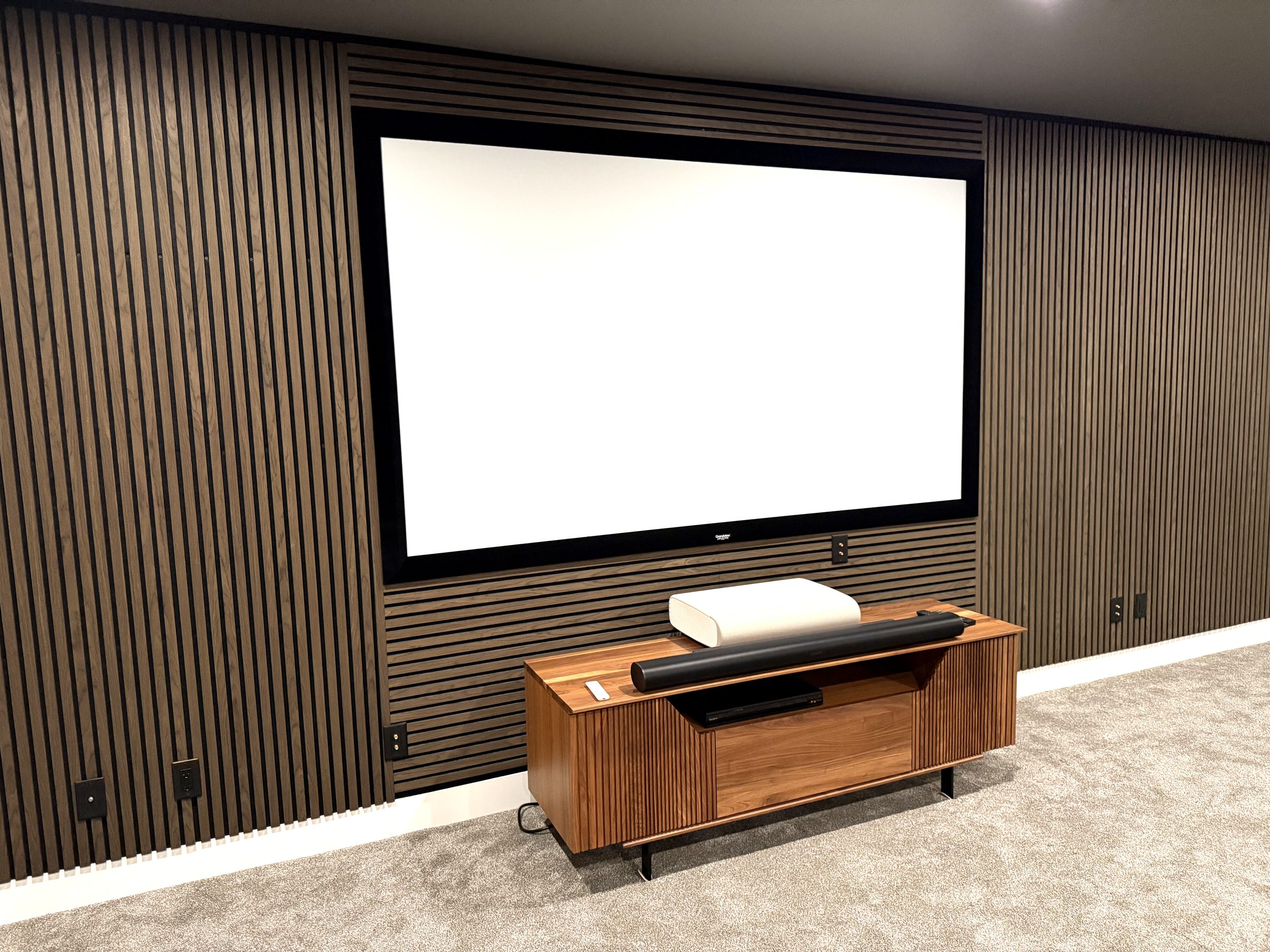 Dark wood slat feature wall in a Kelowna home theatre